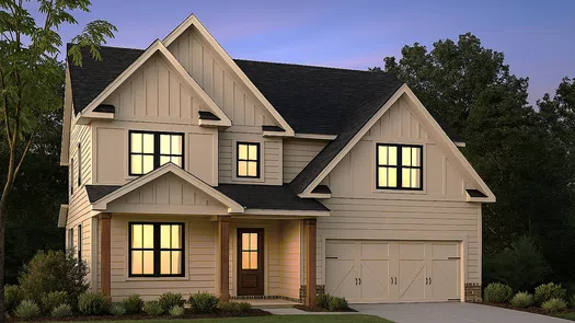 Two-story modern suburban house with lit windows, front porch, and attached garage during twilight.